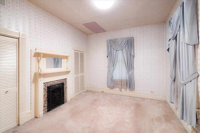 2102 Carr Ave, Memphis, TN 38104 - unfurnished living room featuring carpet and a fireplace
