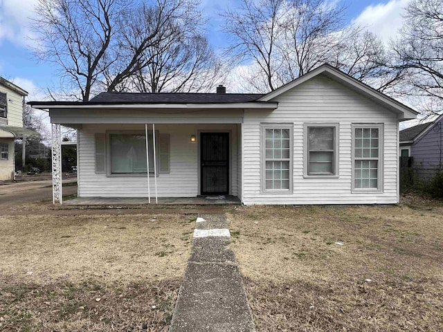 1684 Walter St, Memphis, TN 38108 - view of front facade featuring a porch and a chimney