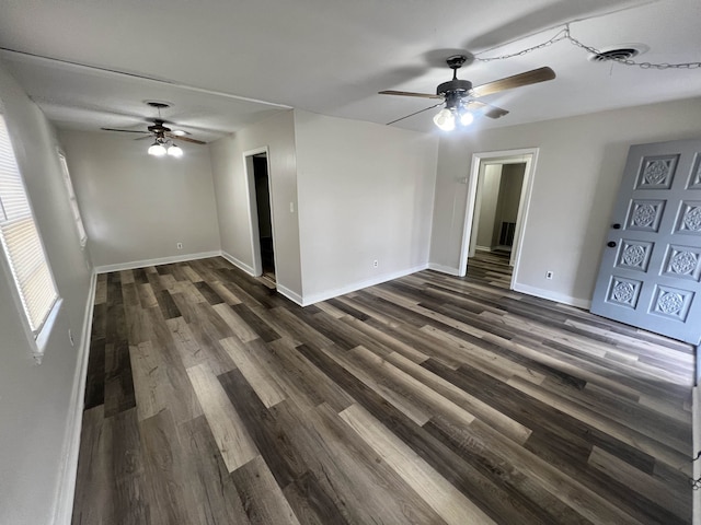 1684 Walter St, Memphis, TN 38108 - spare room with a ceiling fan, dark wood-style flooring, and baseboards