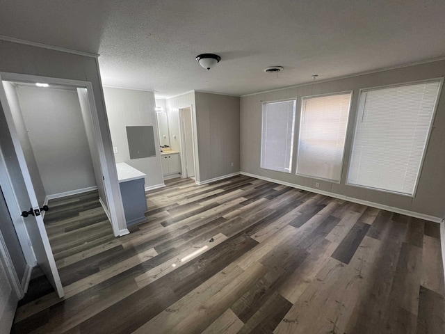1684 Walter St, Memphis, TN 38108 - unfurnished bedroom featuring ornamental molding, wood finished floors, baseboards, and ensuite bathroom