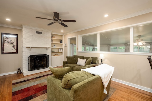 4152 Barfield Rd, Memphis, TN 38117 - living area with a ceiling fan, wood finished floors, crown molding, a fireplace, and baseboards
