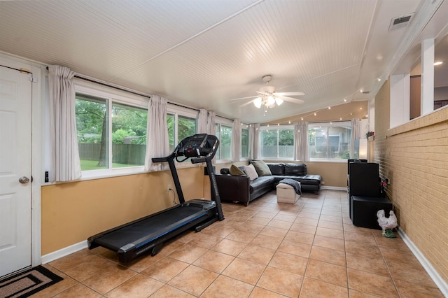 4152 Barfield Rd, Memphis, TN 38117 - exercise room featuring light tile patterned floors, a ceiling fan, brick wall, healthy amount of natural light, and vaulted ceiling