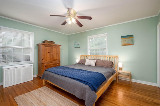 4152 Barfield Rd, Memphis, TN 38117 - bedroom featuring radiator, wood finished floors, baseboards, and crown molding