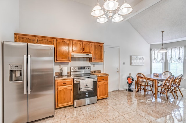 6686 Elmore Ridge Ln, Memphis, TN 38134 - kitchen featuring appliances with stainless steel finishes, high vaulted ceiling, a chandelier, under cabinet range hood, and brown cabinets
