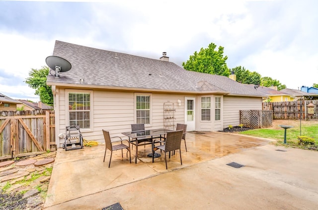 6686 Elmore Ridge Ln, Memphis, TN 38134 - back of house featuring fence, a patio, a chimney, and a gate