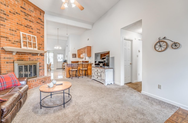 6686 Elmore Ridge Ln, Memphis, TN 38134 - living area featuring baseboards, a ceiling fan, high vaulted ceiling, a fireplace, and beam ceiling