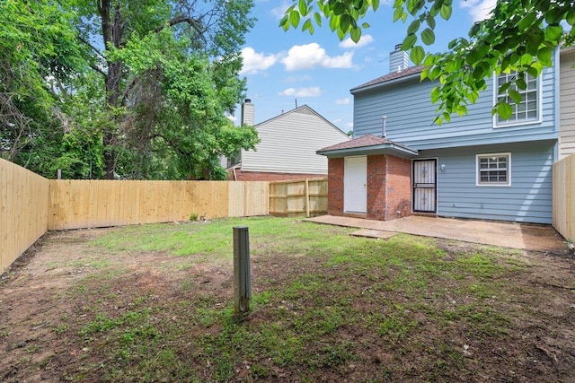 5544 Blossom Ln, Memphis, TN 38115 - back of property with a patio and a chimney