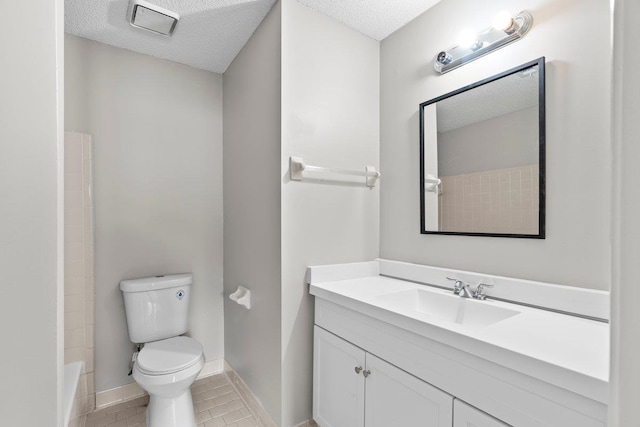 5544 Blossom Ln, Memphis, TN 38115 - full bathroom featuring a textured ceiling, toilet, vanity, baseboards, and a shower