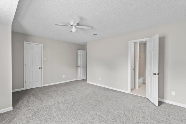 5544 Blossom Ln, Memphis, TN 38115 - unfurnished bedroom with carpet, a textured ceiling, baseboards, and ceiling fan