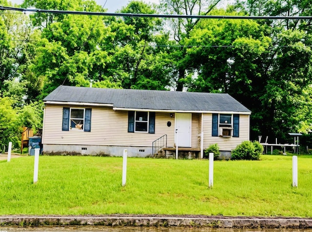 single story home with crawl space, a front yard, and cooling unit