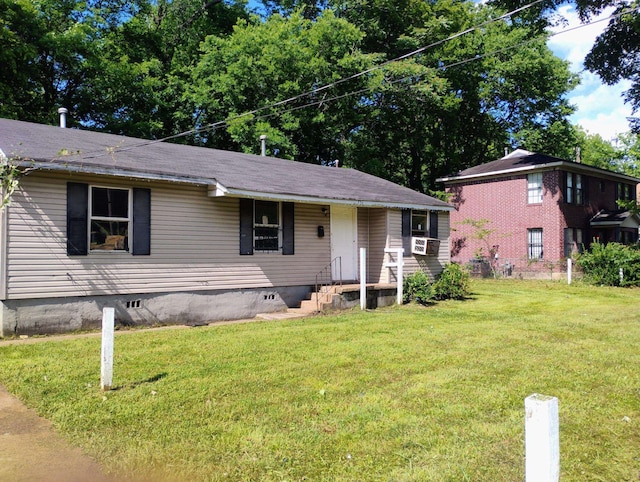 view of front facade with a front yard, crawl space, and cooling unit