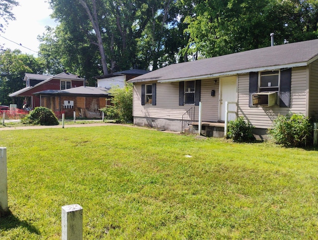 view of front facade featuring a front lawn, cooling unit, and crawl space