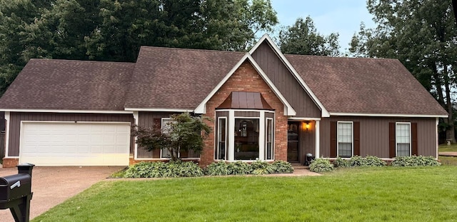 view of front facade featuring driveway, a garage, a front yard, and roof with shingles