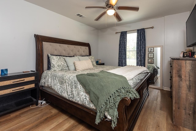 bedroom with wood finished floors and ceiling fan