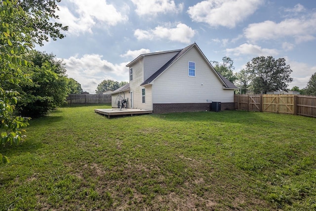 back of house featuring a deck and cooling unit