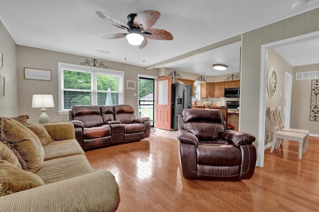6331 Twin Oaks Dr, Millington, TN 38053 - living room with light wood-style floors, ceiling fan, and baseboards