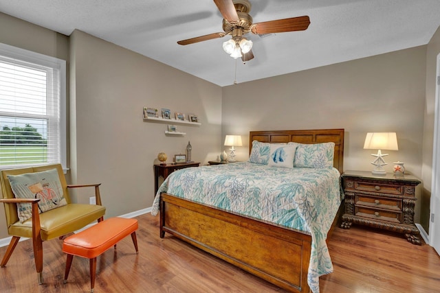 6331 Twin Oaks Dr, Millington, TN 38053 - bedroom with wood finished floors, baseboards, and ceiling fan
