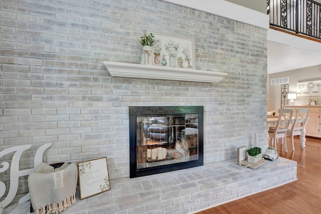 6331 Twin Oaks Dr, Millington, TN 38053 - detailed view of a brick fireplace and wood finished floors