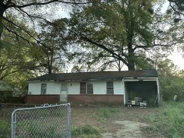 single story home featuring brick siding