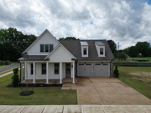 view of front of house with concrete driveway, a porch, a front yard, roof with shingles, and a garage