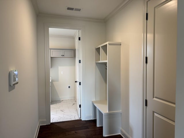 mudroom with marble look tile flooring, ornamental molding, and baseboards