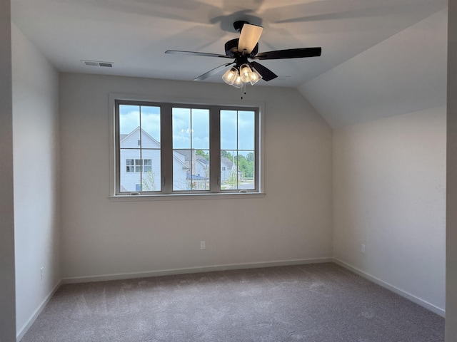 additional living space with carpet, baseboards, ceiling fan, and vaulted ceiling