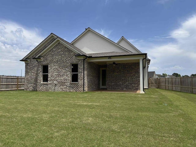 rear view of house with brick siding