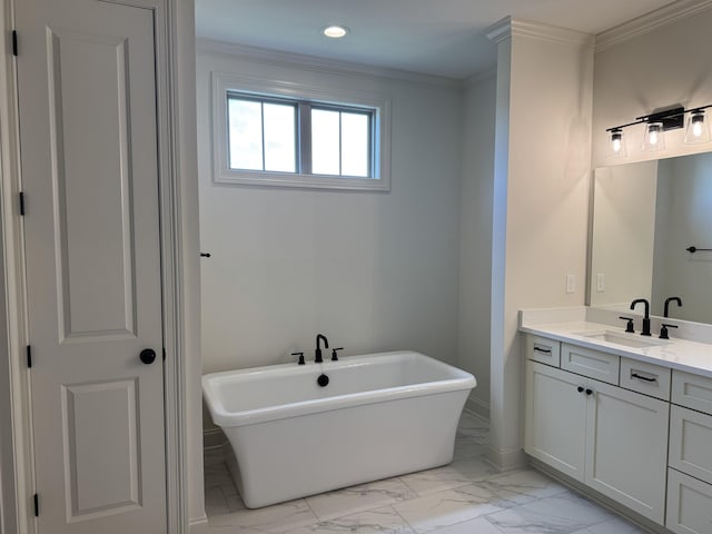 full bath with marble look tile flooring, vanity, a freestanding bath, recessed lighting, and crown molding