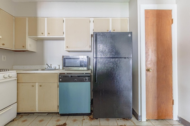 3229 Thirteen Colony Mall Unit 5B, Memphis, TN 38115 - kitchen featuring freestanding refrigerator, dishwashing machine, stainless steel microwave, white gas range, and light countertops