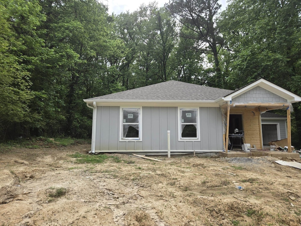 3299 University St, Memphis, TN 38127 - view of front of home with board and batten siding and roof with shingles