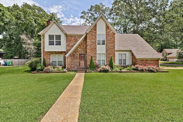 2010 Newfields Rd, Germantown, TN 38139 - view of front of home featuring brick siding, a shingled roof, and a chimney