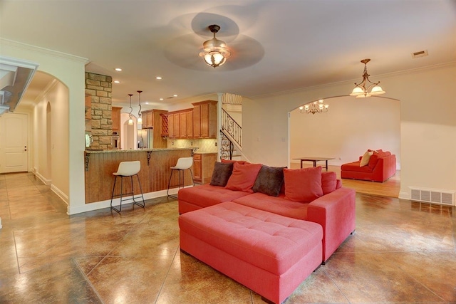 100 Whitehall Ct, Unicorp/Eads, TN 38028 - living area featuring arched walkways, crown molding, a ceiling fan, stairs, and tile patterned floors
