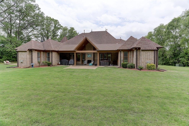 100 Whitehall Ct, Unicorp/Eads, TN 38028 - rear view of property with brick siding, a patio, and a lawn