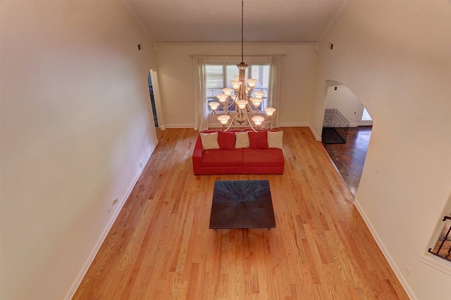 100 Whitehall Ct, Unicorp/Eads, TN 38028 - dining area with ornamental molding, wood finished floors, arched walkways, a chandelier, and baseboards