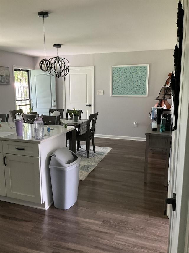 6288 Martinwest Dr, Millington, TN 38053 - dining area featuring dark wood-style flooring, baseboards, and a chandelier