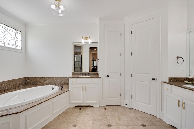 bathroom with a garden tub, a stall shower, tile patterned floors, and two vanities