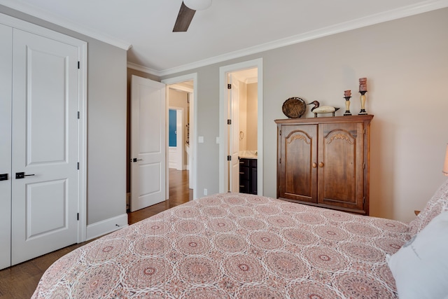 bedroom with ornamental molding, baseboards, ensuite bath, ceiling fan, and wood finished floors