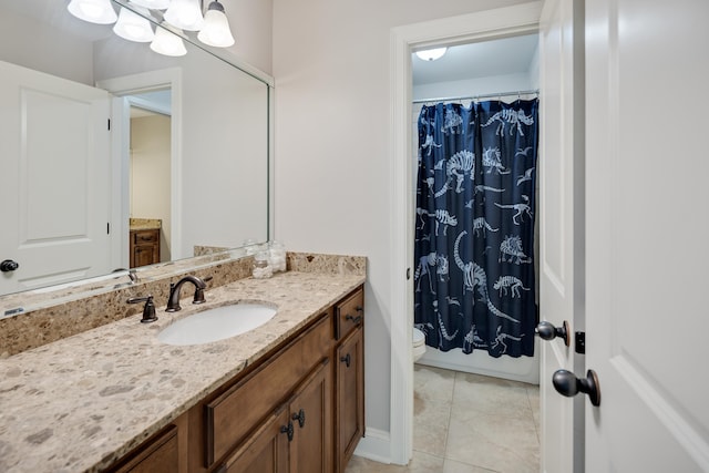 bathroom featuring vanity, a shower with shower curtain, and toilet
