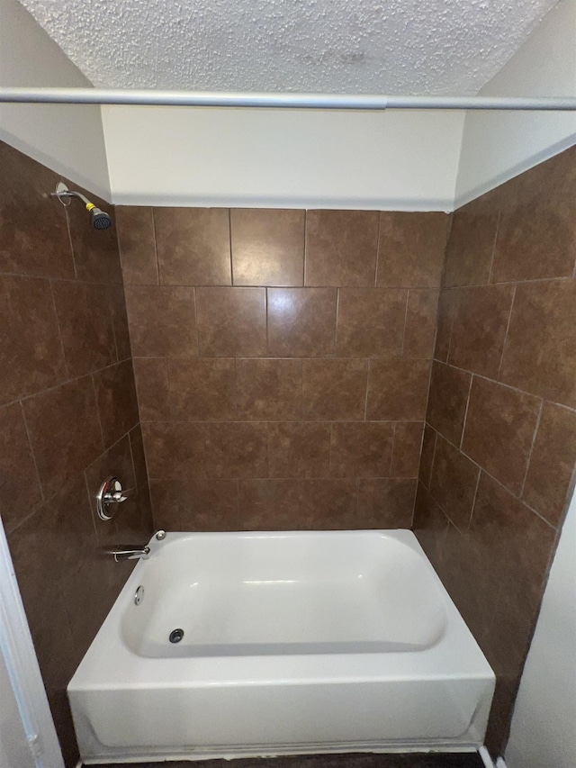 4034 Edgehill St, Memphis, TN 38128 - bathroom featuring a textured ceiling and shower / bathtub combination