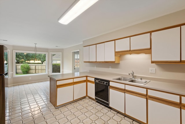 kitchen featuring dishwasher, a sink, light countertops, white cabinetry, and a peninsula