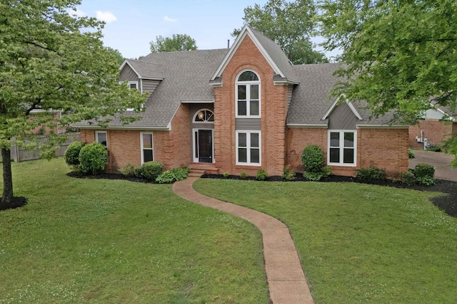 traditional-style house with roof with shingles and brick siding