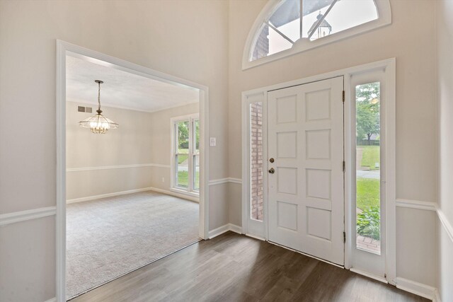 8450 Stoksund Cv, Memphis, TN 38018 - foyer with a chandelier, dark wood-type flooring, and baseboards