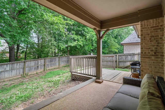 view of patio / terrace with a fenced backyard and a deck