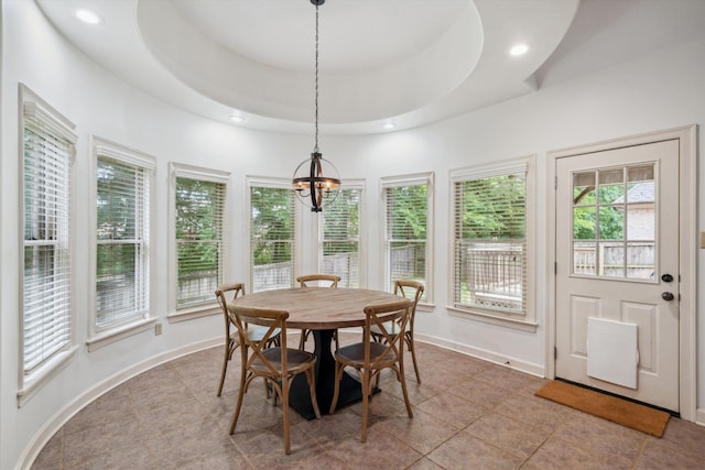 tiled dining space with a chandelier, recessed lighting, and baseboards