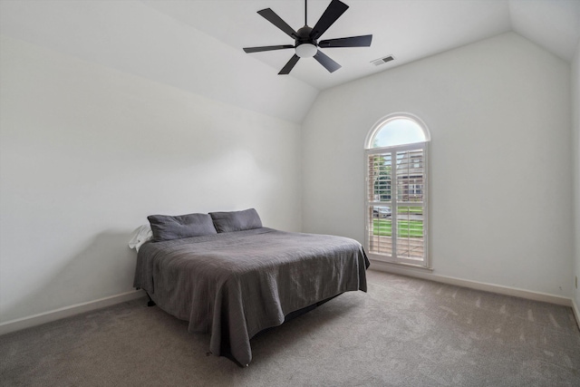 bedroom with vaulted ceiling, carpet, baseboards, and a ceiling fan