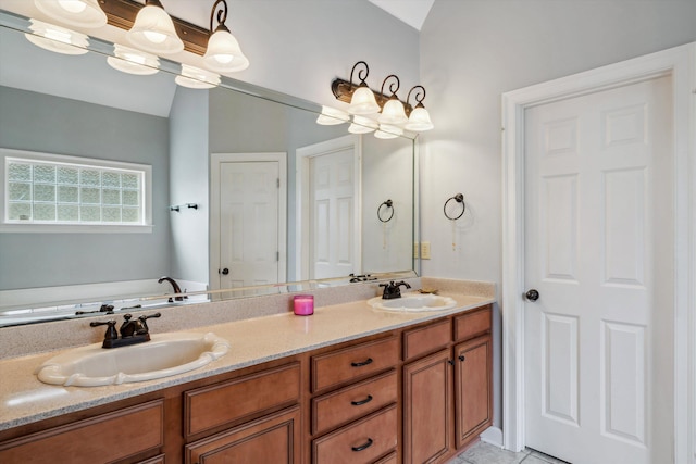bathroom with double vanity and a bath