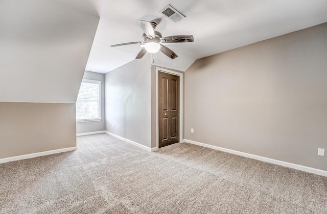 bonus room with carpet, a ceiling fan, baseboards, and lofted ceiling