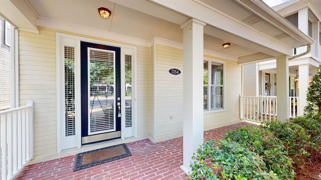1354 E Island Pl, Memphis, TN 38103 - property entrance featuring covered porch and brick siding