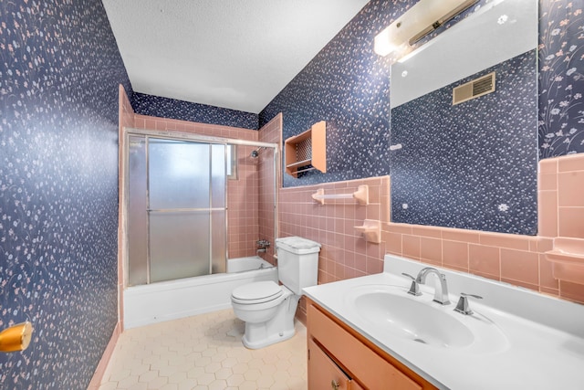 6196 Ivanhoe Cv, Bartlett, TN 38134 - bathroom with wallpapered walls, vanity, a textured ceiling, toilet, and tile patterned flooring