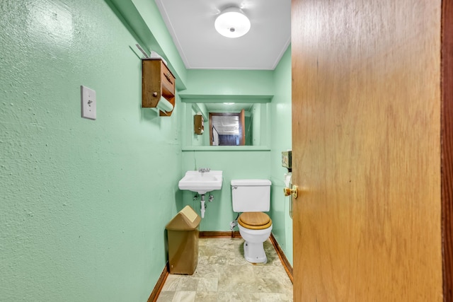 6196 Ivanhoe Cv, Bartlett, TN 38134 - half bathroom with toilet, baseboards, and stone finish flooring